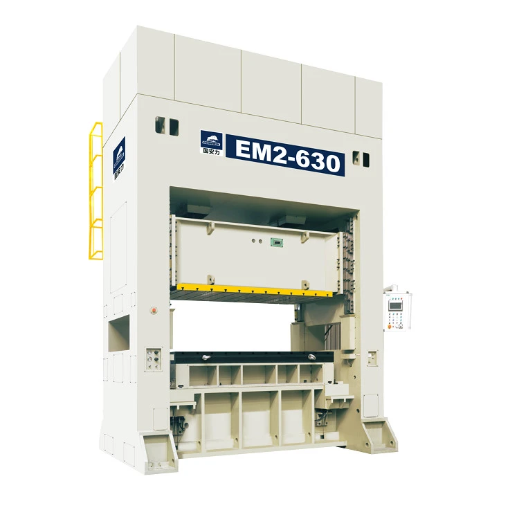 A light-coloured straight side servo press with EM2-630 model plate and a yellow access ladder and railing at the side